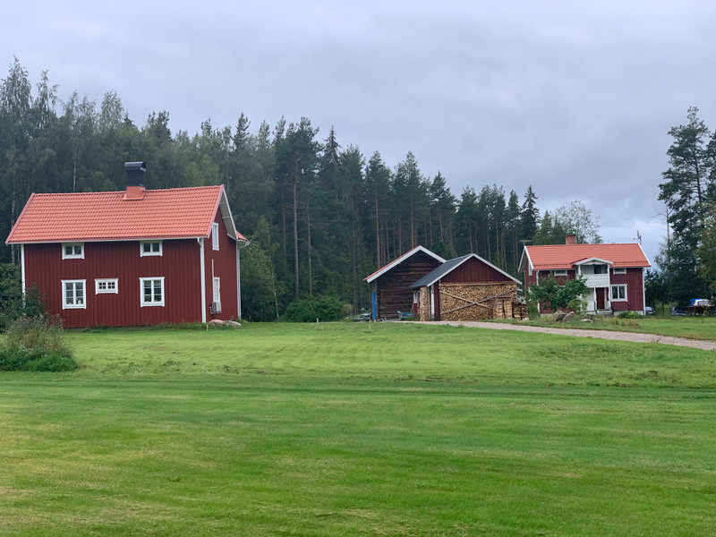 Typical newer red log homes & sheds