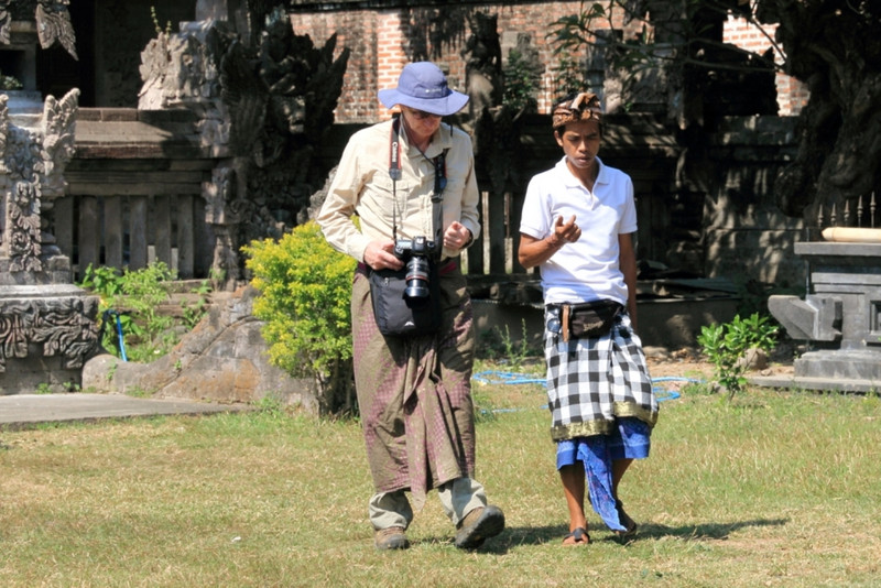 Elegant traveller with Balinese guide