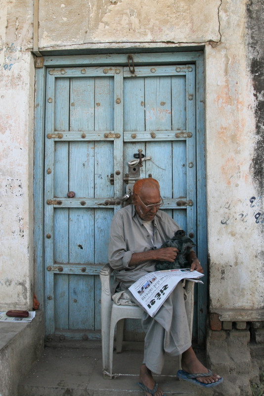 Gujarati man reading his paper