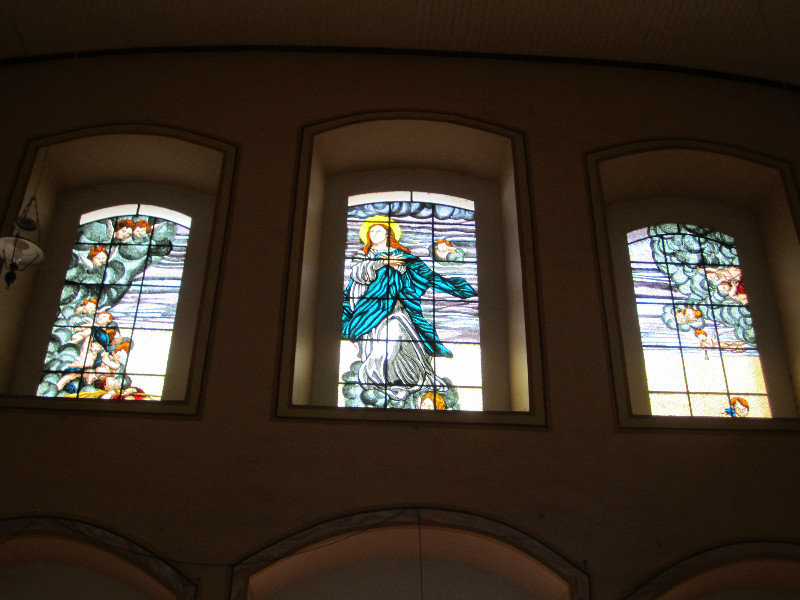 Stained glass windows over altar