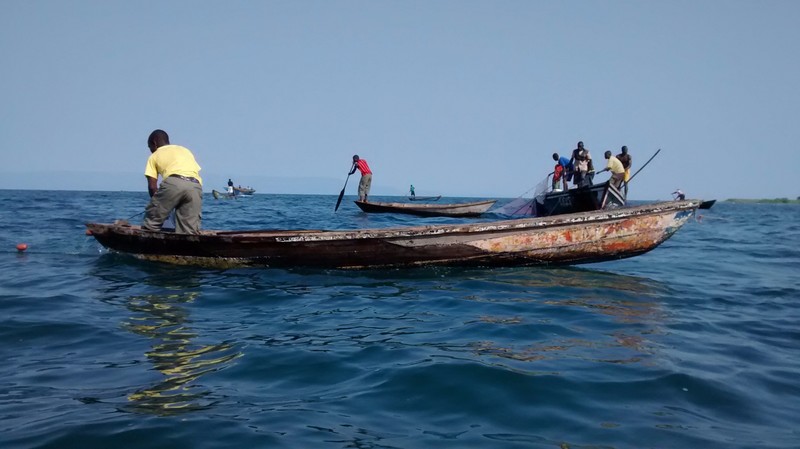 Kapenta Fishermen laying a net