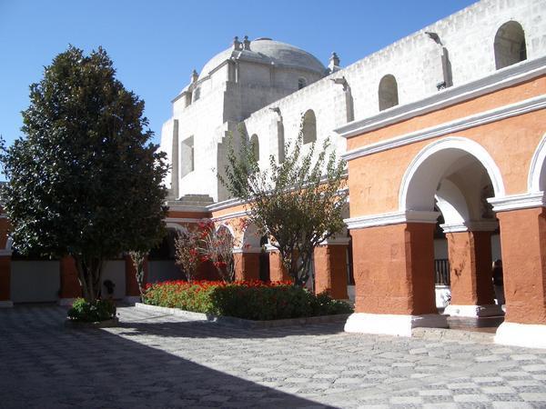 A courtyard and the church in Santa Catalina