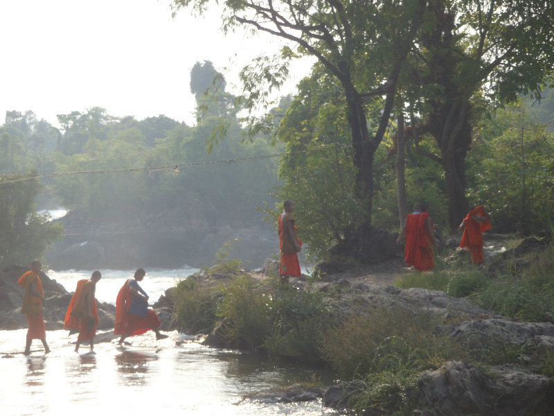 Young monks ready for a swim in the quieter side pool of the falls.