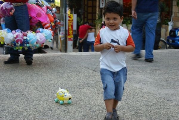 the boy with a turtle balloon