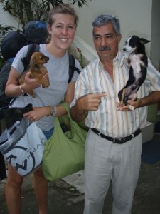 the owner of our hostel in tena with his dogs