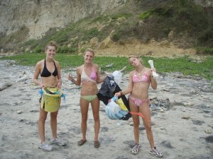 collecting trash on the beach