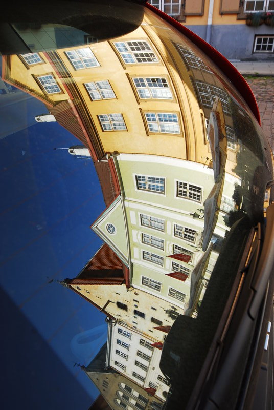 Audi rear window reflecting Tallin's old town