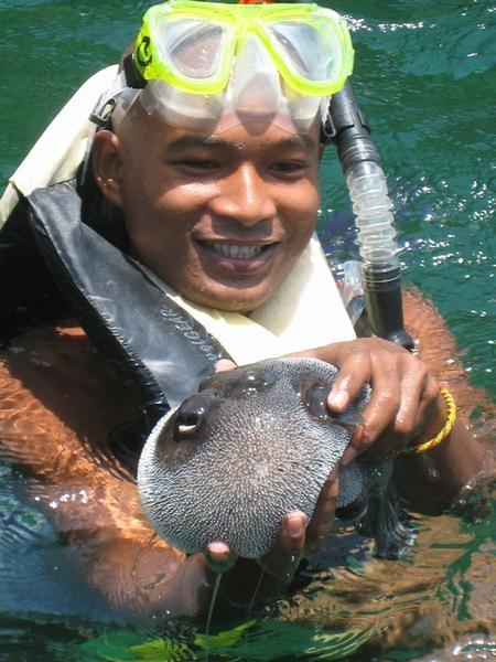Our snorkel guide with a puffer fish