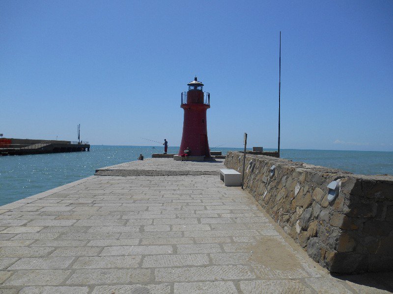 Lighthouse marking entrance to harbor