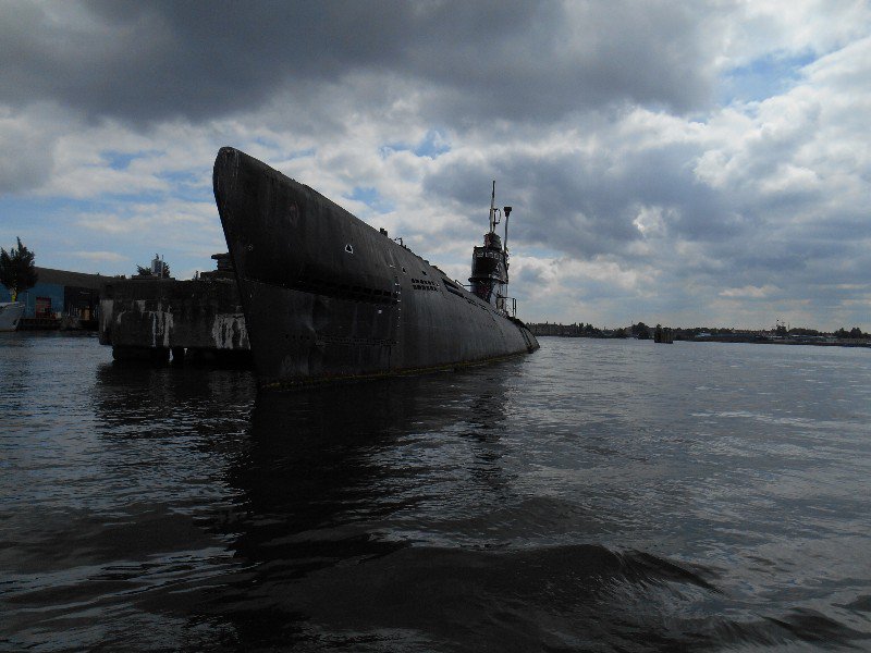 A Russian submarine sinking in the harbor