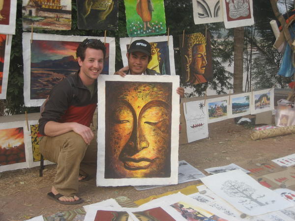 Me, Tony (I dont know his real name), and Buddha (one of the paintings I bought from him)