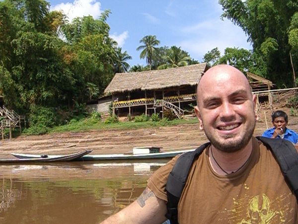 Jeff in a boat on the Mekong