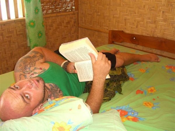 Jeff reading in our hut on Seraya