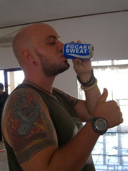 Jeff drinking "sweat" at the Labuanbajo airport