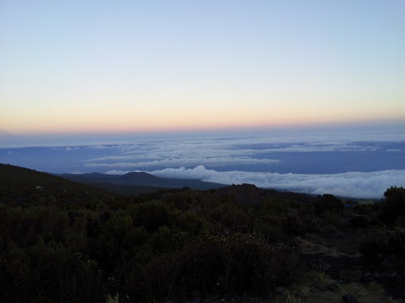 Above the clouds and sunset