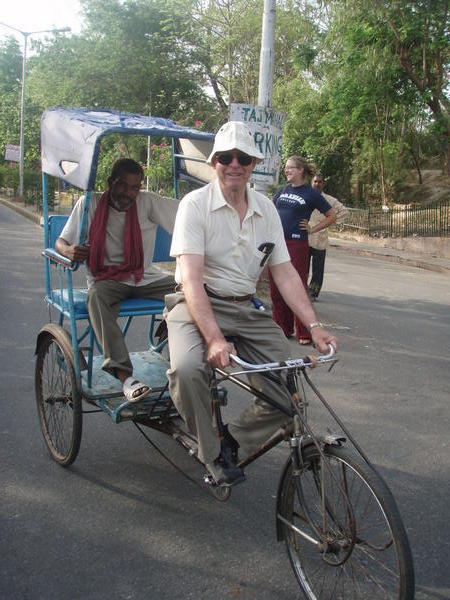 grandpa driving a rickshaw!