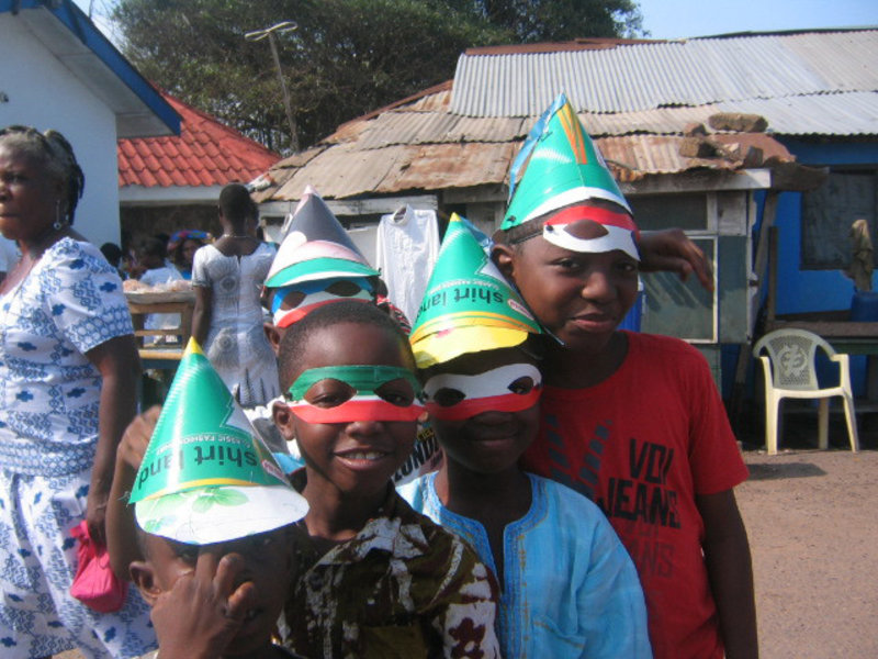 Children wearing hats and masks