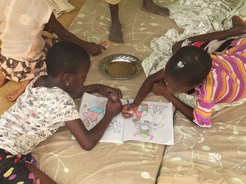 The kids are enjoying the coloring books we brought