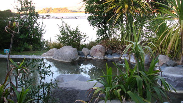 A thermal pool at the spa overlooking Lake Rotorua