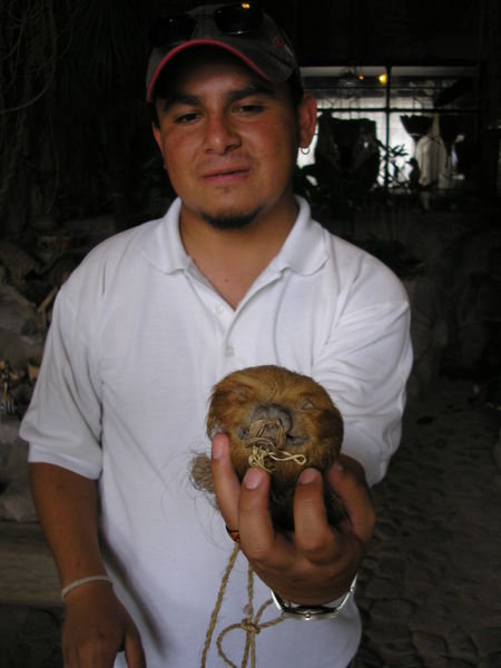 Our guide with a shrunken sloth head
