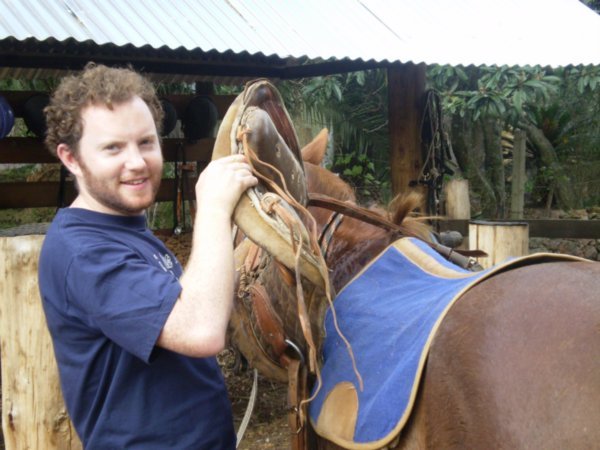 Ed saddling his horse
