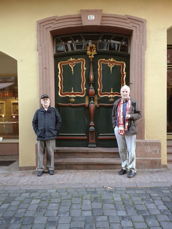 Miltenberg: An old carved wooden door painted to enhance the design. Dick on the left, Ferdi on the right.