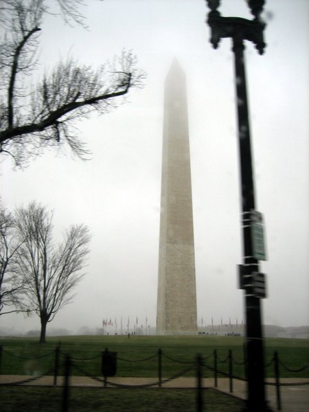 Clouds cover the tip of the Washington Monument