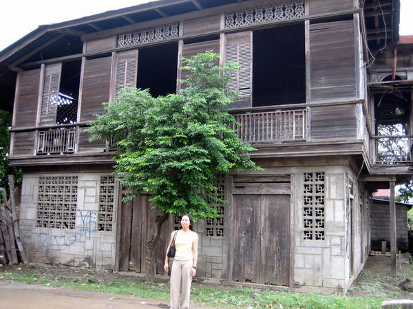 Standing by one side of the old house