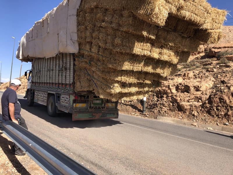 Overloaded straw bale truck