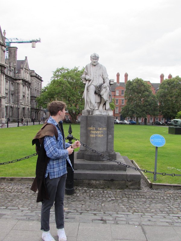 Our guide and statue of Provost George Salmon