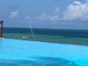 Pool and boat on the ocean