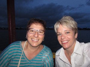 Susan and Lori on boat cruise on Tonle Sap River