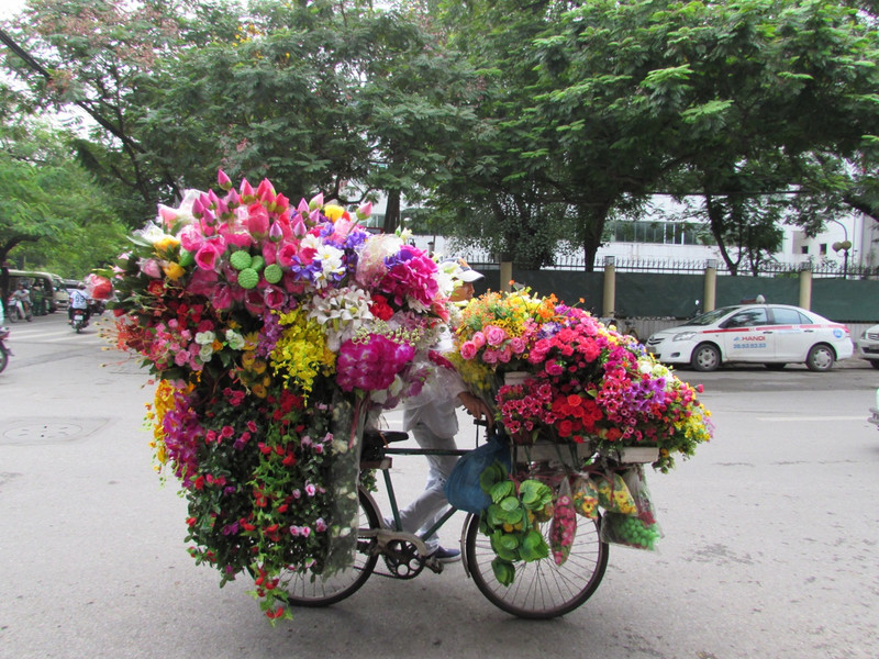 Hanoi cyclist with flowers