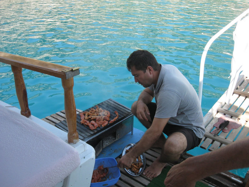 Boat owner preparing lunch for the group