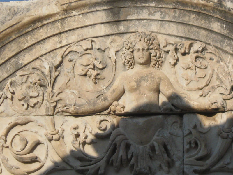 Carving of the statue of Tykhe (the Goddess of Fate) on the Temple of Hadrian