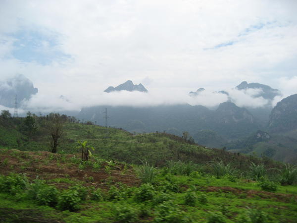 En route from Vientiane to Vang Vieng. Look at the mountains peeking out of the clouds