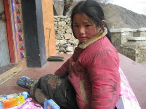 A girl playing in Drepung 