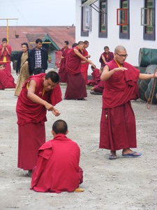 Monks practicing debate