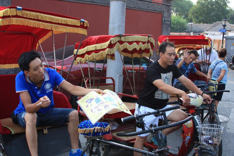 Beijing - Hutong rickshaw drivers waiting for customers