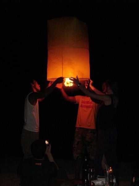 Preparing a sky lantern on Thong Nai Pan Yai beach