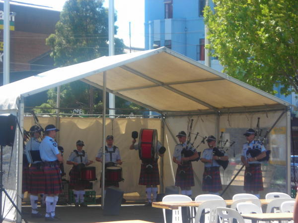 The Police Pipe Band playing at the Market on sunday bagpipes & all!