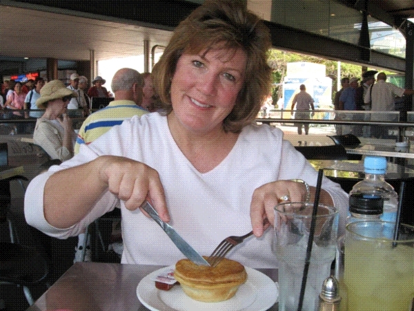Kathy trying a meat pie!