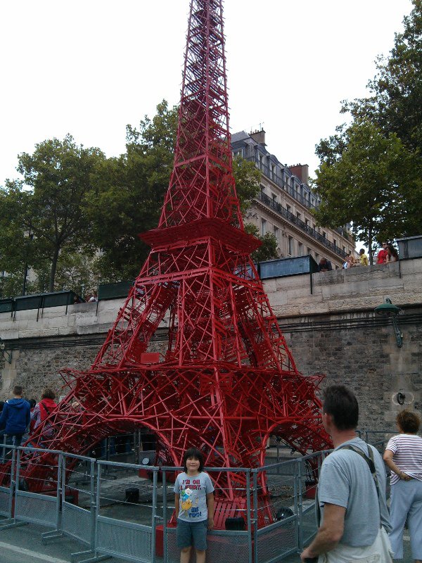 Eiffel Tower sculpture made from chairs.