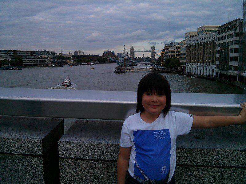 Standing on London Bridge with the Thames and Tower Bridge behind.