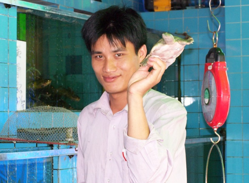 A Chinese man with his sea turtle