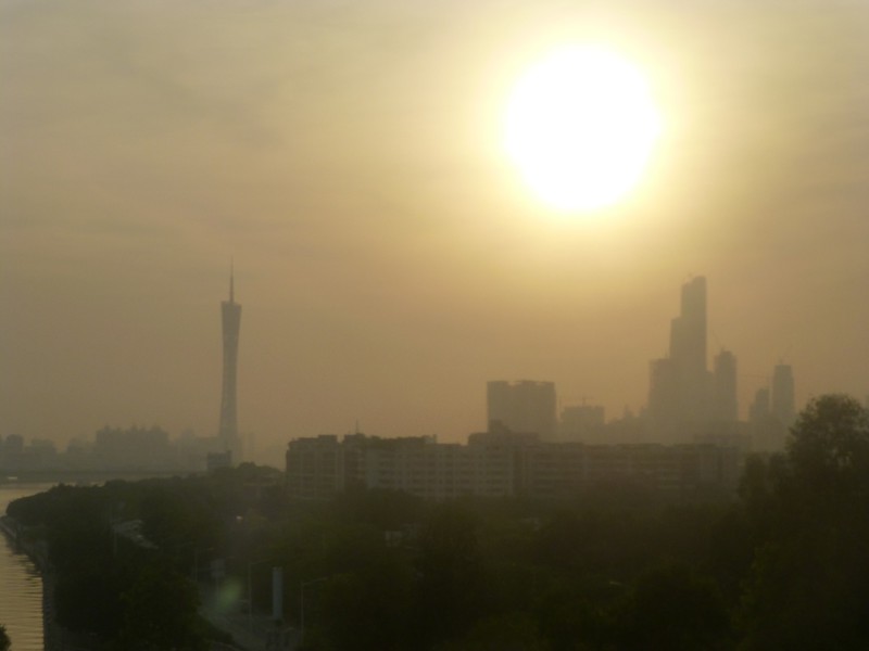Hazy, smog filled city skyline.