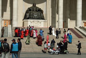 Photos in from of parliament building and Genghis Khan