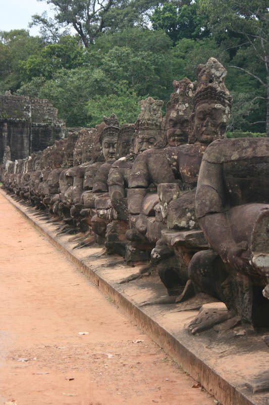 Statues on bridge over moat - into Angkor Thom