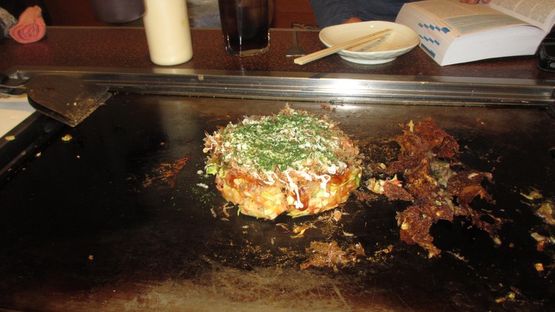 Okonomiyaki being cooked for us