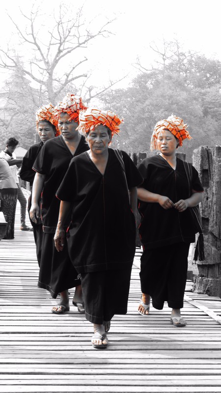 Tribes women waling across U-Bein bridge